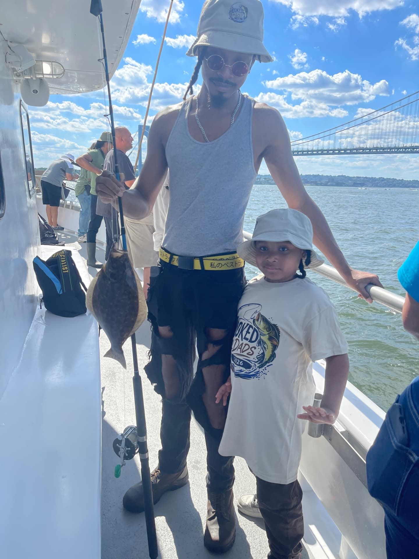 A community member and child on a boat outing